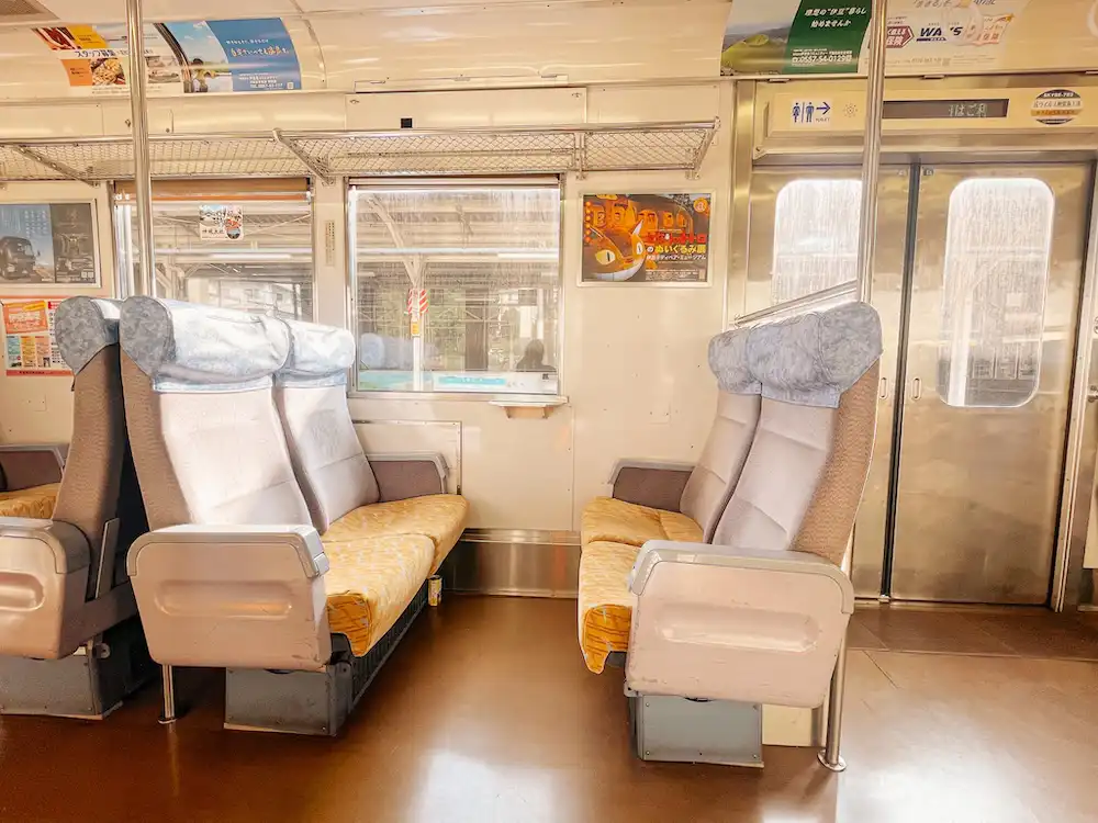 Train seats on a local train in Atami, Japan.
