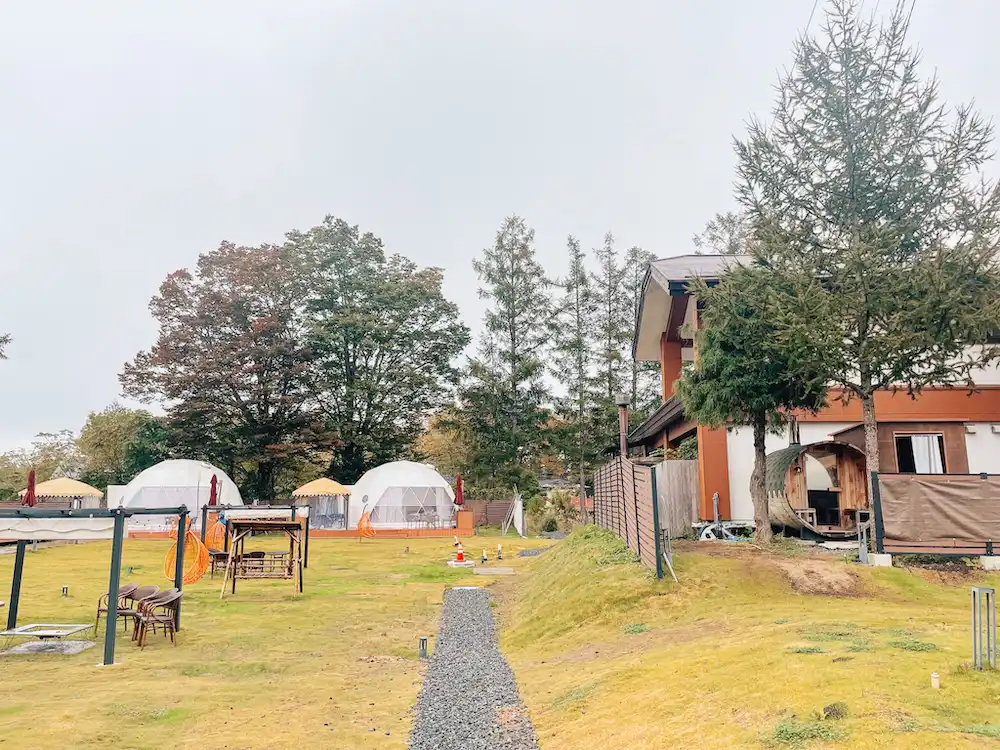 White glamping domes in a camping ground at Gramercy Village, Lake Yamanaka