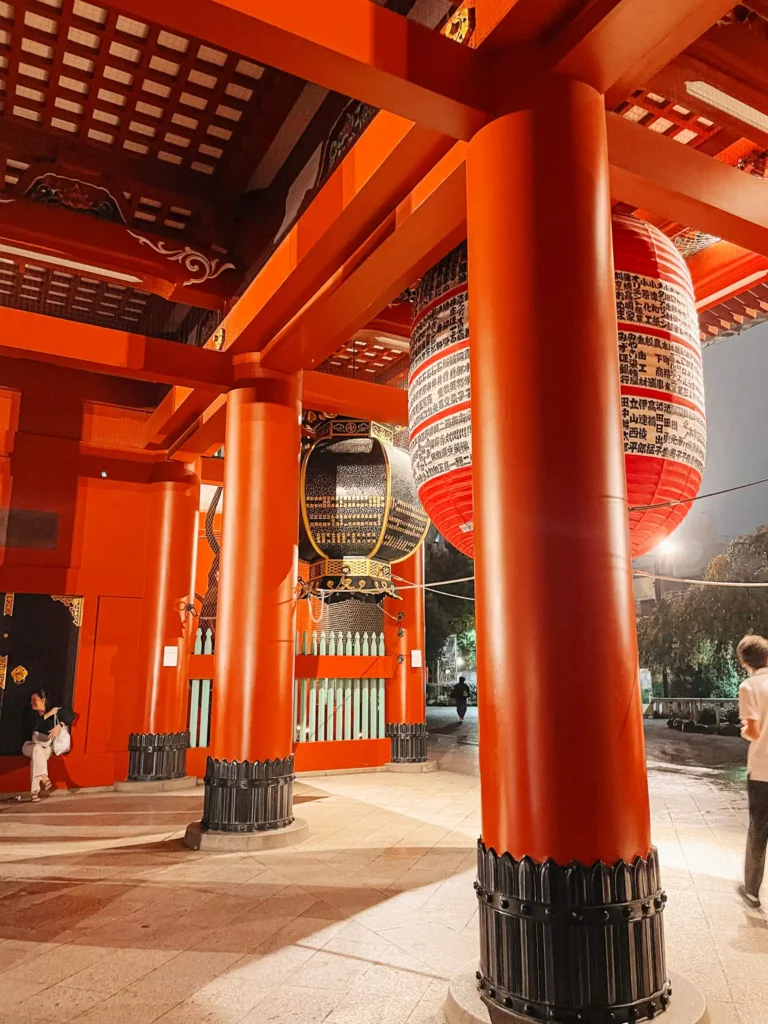 The red gate of Senso-ji Temple in Asakusa glowing at night.