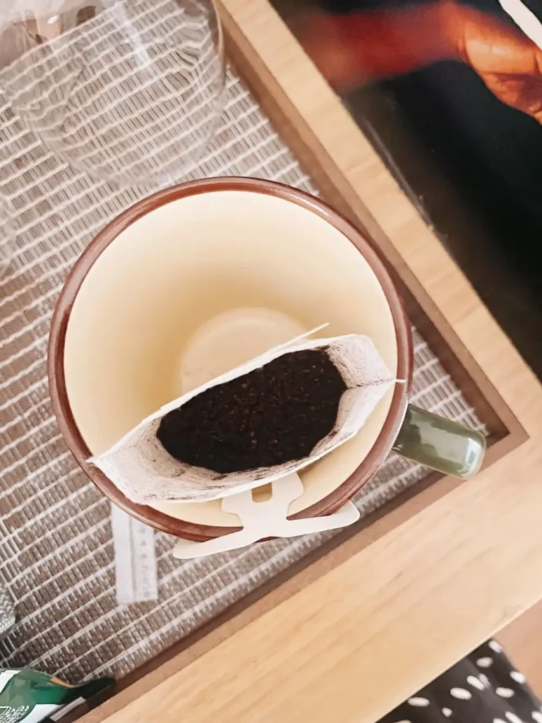 A birds eye view of a mug with filtered coffee in it